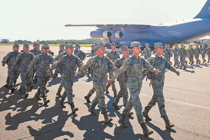 Soldiers from China arrive at an air force base in Belarus near border with Ukraine for joint military exercise Eagle Assault-2024