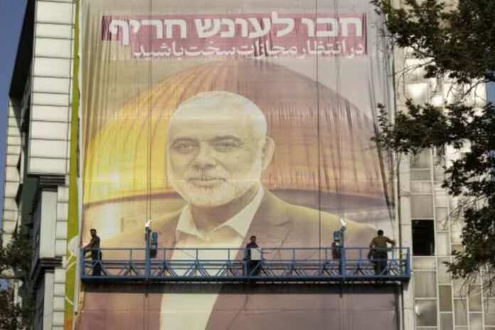 Iran government puts up a massive poster of Ismail Haniyeh in Tehran, warning Israel of severe retaliation for the killing of the Hamas chief